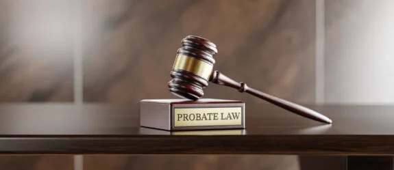 Probate law: Judge's Gavel as a symbol of legal system and wooden stand with text word.